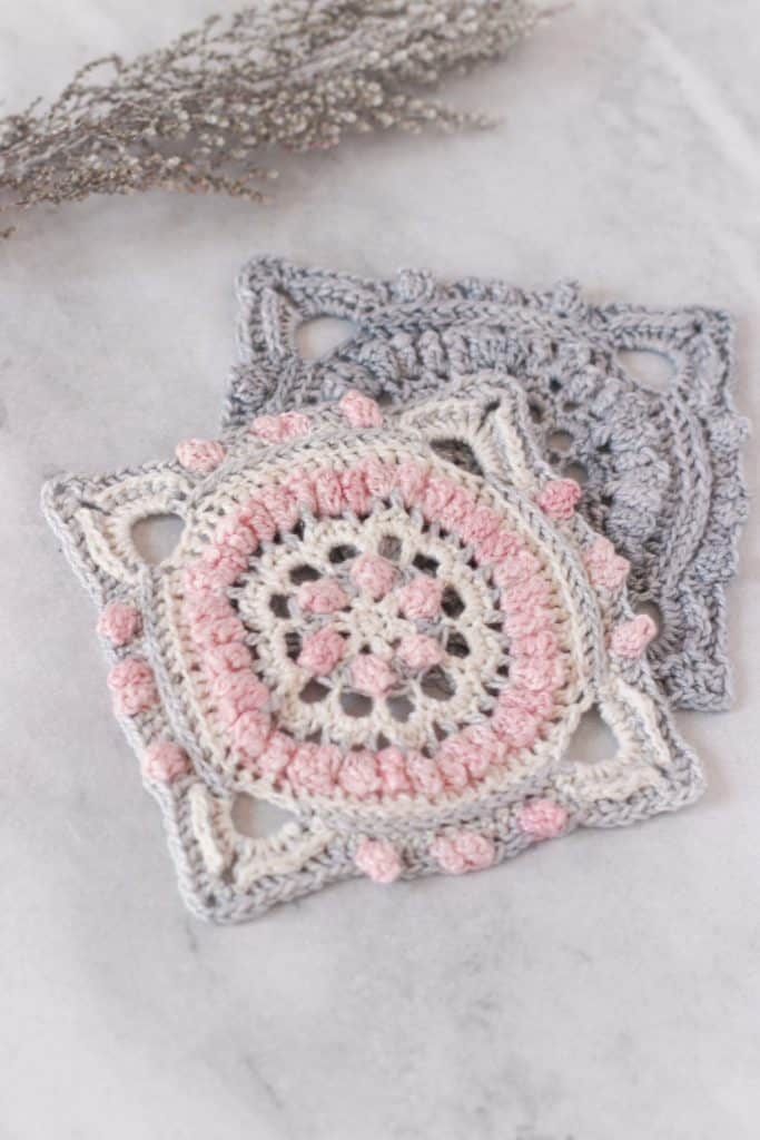Free crochet square pattern for afghan, free afghan square pattern using fingering weight yarn, pretty crochet squares in pink, grey and cream with a touch of navy blue.