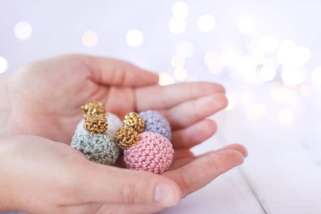 mini crochet Christmas bauble in pastel colors